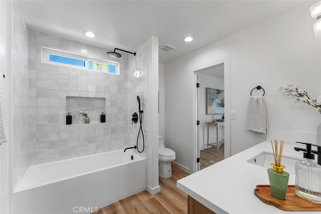 15016 Firmona Ave, Lawndale, CA 90260 - bathroom with washtub / shower combination, wood finished floors, vanity, and recessed lighting
