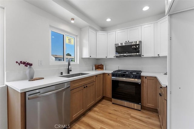 15016 Firmona Ave, Lawndale, CA 90260 - kitchen featuring stainless steel appliances, light wood finished floors, white cabinets, light countertops, and recessed lighting