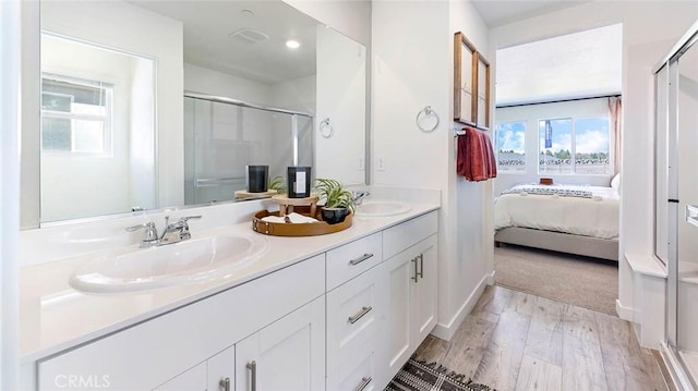 766 Pico Pl, Chico, CA 95928 - ensuite bathroom featuring a shower stall, double vanity, wood finished floors, and recessed lighting