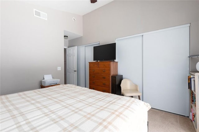 31858 Corte Priego, Temecula, CA 92592 - bedroom featuring multiple closets, carpet floors, a towering ceiling, and ceiling fan