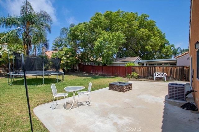 31858 Corte Priego, Temecula, CA 92592 - fenced backyard featuring a trampoline, a fire pit, and a patio