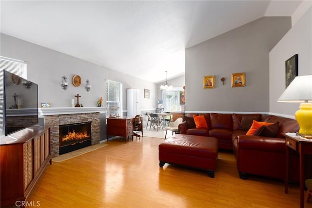 31858 Corte Priego, Temecula, CA 92592 - living room featuring vaulted ceiling, a fireplace, wood finished floors, and plenty of natural light