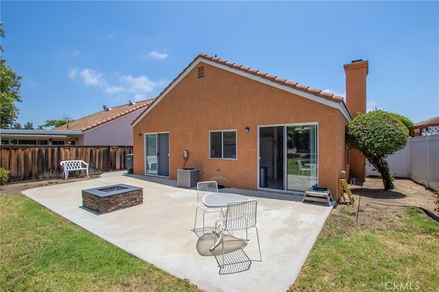 31858 Corte Priego, Temecula, CA 92592 - rear view of house with an outdoor fire pit, a patio, stucco siding, and a fenced backyard