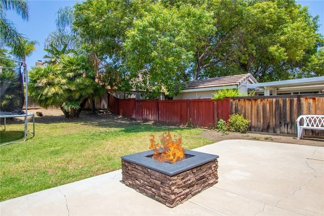 31858 Corte Priego, Temecula, CA 92592 - fenced backyard with a trampoline, an outdoor fire pit, and a patio