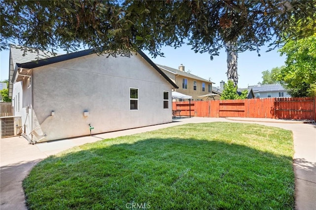1619 Harvest Glen Dr, Chico, CA 95928 - back of house with a fenced backyard and stucco siding