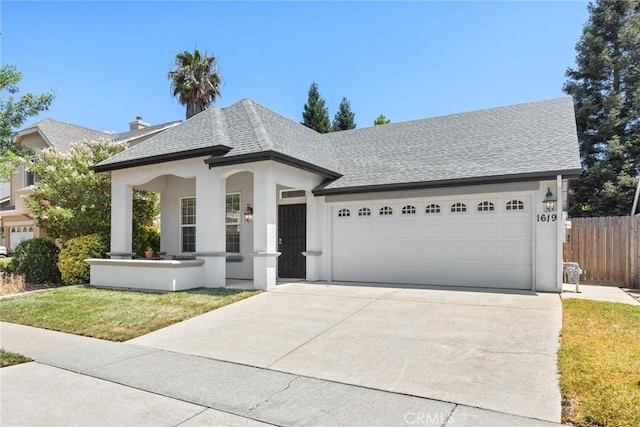 1619 Harvest Glen Dr, Chico, CA 95928 - view of front of home with a garage, concrete driveway, roof with shingles, and stucco siding