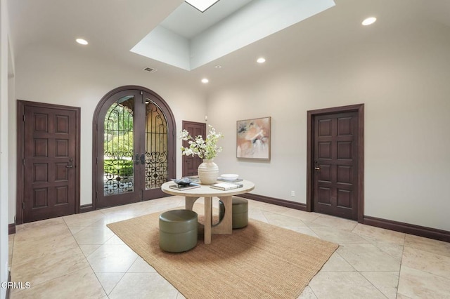 1897 Braemar Rd, Pasadena, CA 91103 - foyer entrance with recessed lighting, arched walkways, light tile patterned floors, and a high ceiling