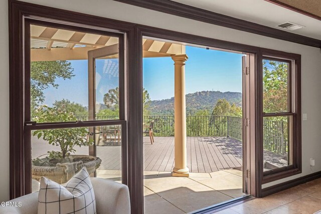 1897 Braemar Rd, Pasadena, CA 91103 - doorway featuring tile patterned flooring, a mountain view, and ornamental molding