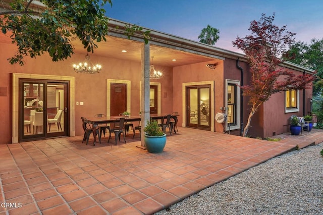 1897 Braemar Rd, Pasadena, CA 91103 - back of house at dusk with a patio and stucco siding