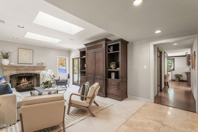 1897 Braemar Rd, Pasadena, CA 91103 - living area with a premium fireplace, light tile patterned floors, a skylight, recessed lighting, and healthy amount of natural light