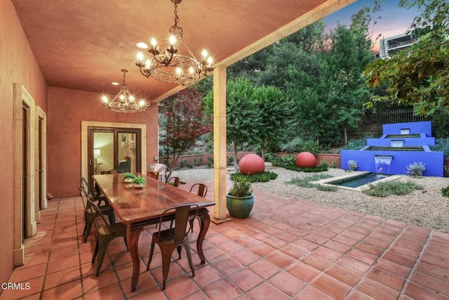 1897 Braemar Rd, Pasadena, CA 91103 - patio terrace at dusk featuring a patio and outdoor dining space