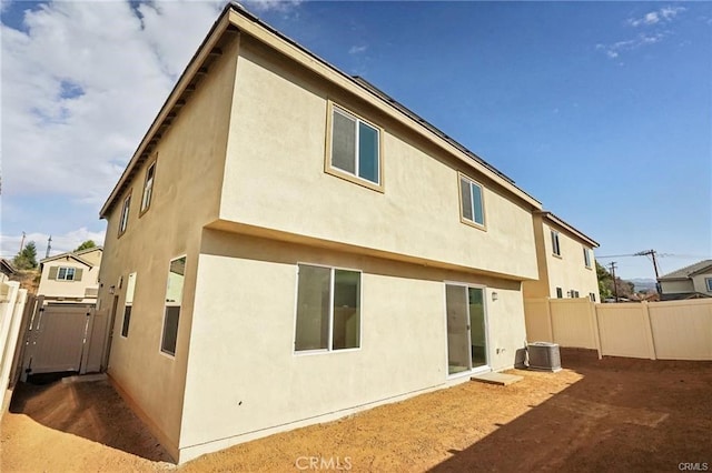 34261 Summer Ln, Yucaipa, CA 92399 - rear view of house with stucco siding and a fenced backyard