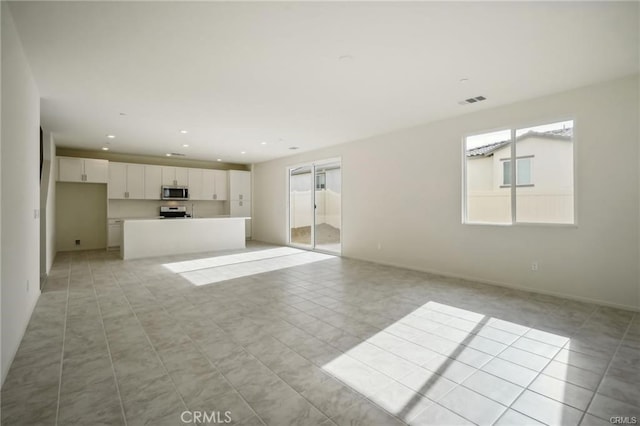 34261 Summer Ln, Yucaipa, CA 92399 - unfurnished living room featuring recessed lighting