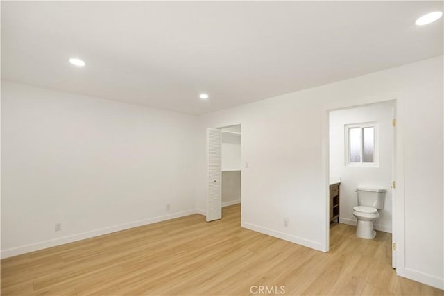 934 W Calora St, San Dimas, CA 91773 - unfurnished bedroom featuring light wood-style floors, recessed lighting, connected bathroom, a closet, and a spacious closet