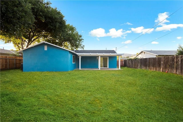 934 W Calora St, San Dimas, CA 91773 - rear view of house featuring a fenced backyard, stucco siding, and a patio area