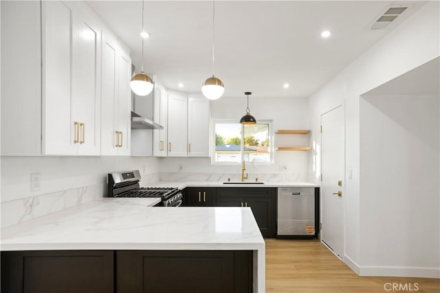 934 W Calora St, San Dimas, CA 91773 - kitchen featuring stainless steel appliances, white cabinetry, range hood, light stone countertops, and recessed lighting