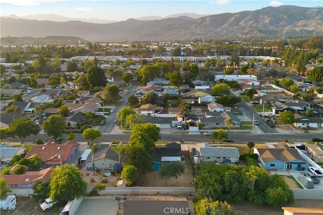 934 W Calora St, San Dimas, CA 91773 - aerial view of property and surrounding area featuring a mountain backdrop and nearby suburban area