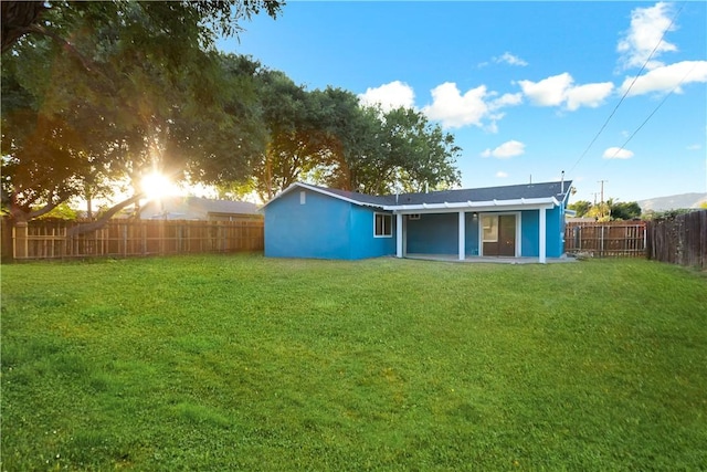 934 W Calora St, San Dimas, CA 91773 - back of house with a fenced backyard and stucco siding