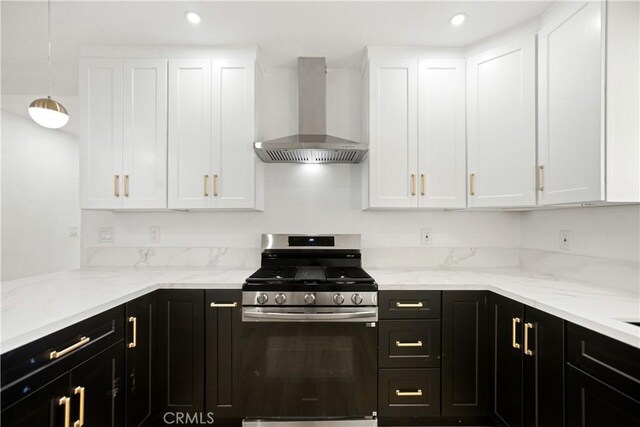 934 W Calora St, San Dimas, CA 91773 - kitchen with stainless steel gas stove, wall chimney exhaust hood, white cabinets, dark cabinets, and recessed lighting