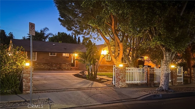 15711 Hiawatha St, Granada Hills, CA 91344 - view of front of property featuring a fenced front yard, driveway, and stucco siding