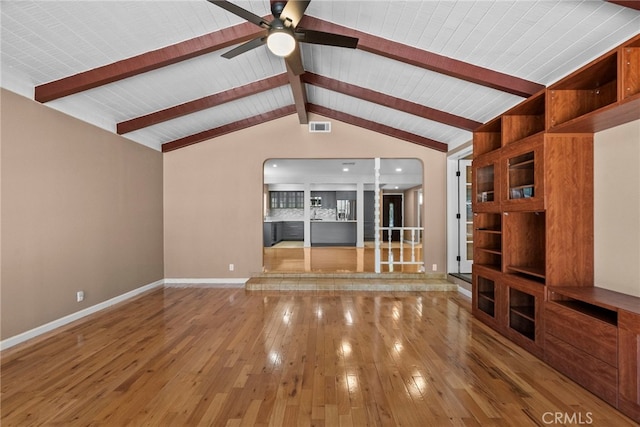 15711 Hiawatha St, Granada Hills, CA 91344 - unfurnished living room featuring hardwood / wood-style floors, ceiling fan, and arched walkways