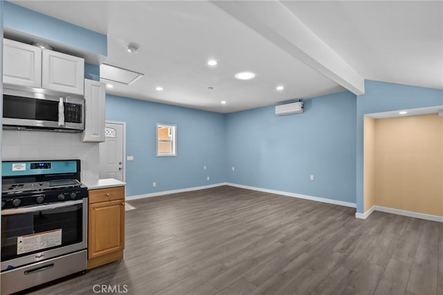 15711 Hiawatha St, Granada Hills, CA 91344 - kitchen with stainless steel appliances, dark wood finished floors, light countertops, decorative backsplash, and recessed lighting