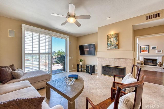 17 Siena, Laguna Niguel, CA 92677 - living room with a tiled fireplace, ceiling fan, and light tile patterned floors