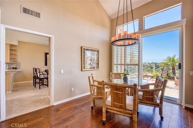 17 Siena, Laguna Niguel, CA 92677 - dining area featuring wood finished floors, a chandelier, and high vaulted ceiling