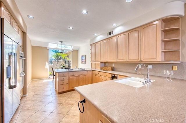 17 Siena, Laguna Niguel, CA 92677 - kitchen with light brown cabinets, a peninsula, white appliances, recessed lighting, and light countertops