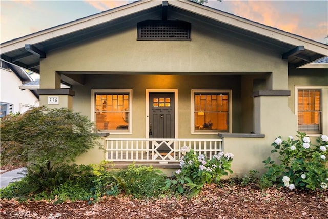 375 E 1st Ave, Chico, CA 95926 - view of front facade featuring a porch and stucco siding