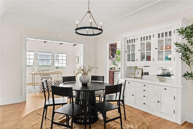 375 E 1st Ave, Chico, CA 95926 - dining room featuring a chandelier, light wood-type flooring, and ornamental molding