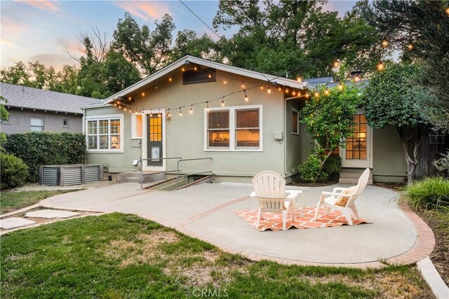 375 E 1st Ave, Chico, CA 95926 - rear view of property with a patio area, stucco siding, and entry steps