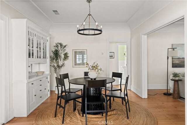 375 E 1st Ave, Chico, CA 95926 - dining area with a chandelier and light wood-style flooring