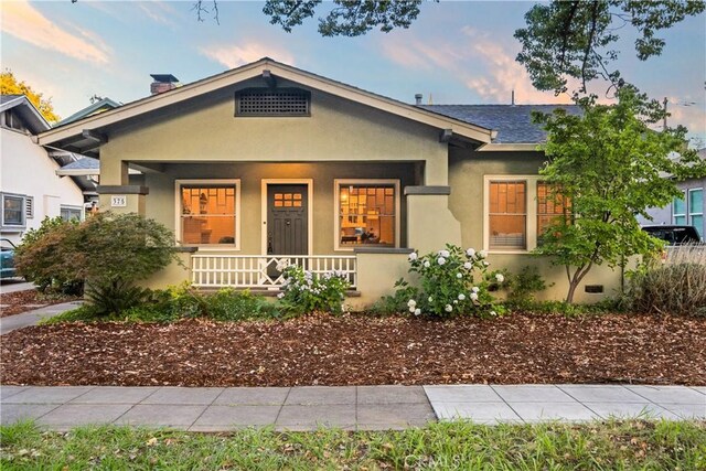 375 E 1st Ave, Chico, CA 95926 - view of front of home featuring covered porch and stucco siding