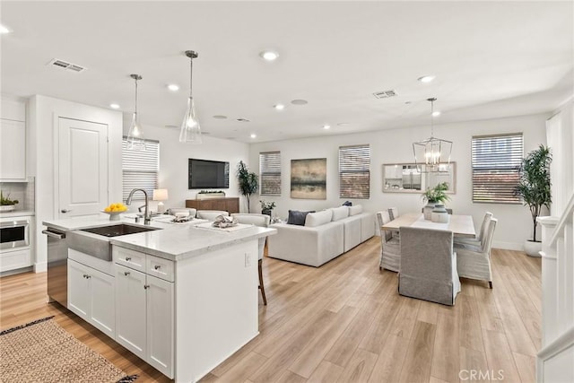 27636 S Evergreen Pl, San Pedro, CA 90732 - kitchen with appliances with stainless steel finishes, a chandelier, recessed lighting, white cabinetry, and light wood finished floors