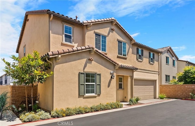 27636 S Evergreen Pl, San Pedro, CA 90732 - view of front of house featuring a garage, a tile roof, and stucco siding