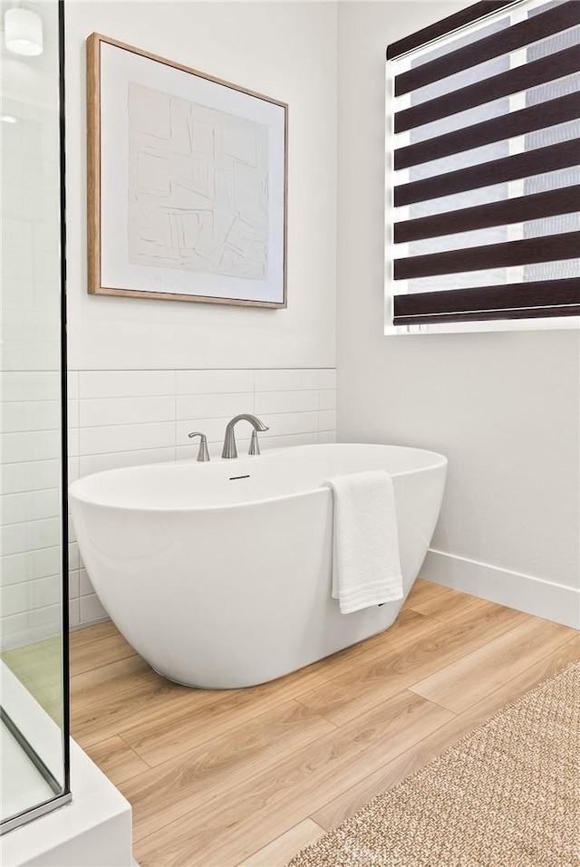 27636 S Evergreen Pl, San Pedro, CA 90732 - full bathroom with a freestanding tub and wood finished floors