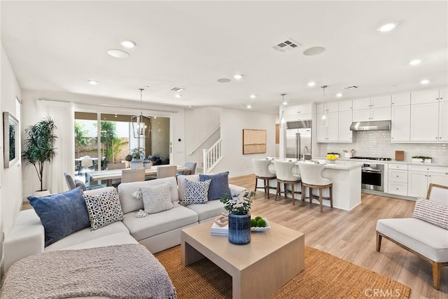 27636 S Evergreen Pl, San Pedro, CA 90732 - living area with stairway, recessed lighting, and light wood finished floors