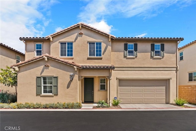 27636 S Evergreen Pl, San Pedro, CA 90732 - view of front facade featuring stucco siding, an attached garage, a tiled roof, and driveway