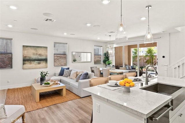 27636 S Evergreen Pl, San Pedro, CA 90732 - living room with light wood-type flooring, recessed lighting, and stairs