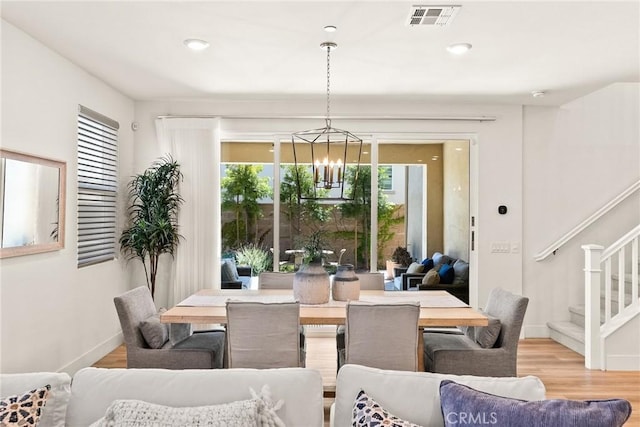 27636 S Evergreen Pl, San Pedro, CA 90732 - dining area featuring stairway, a chandelier, healthy amount of natural light, light wood-style flooring, and recessed lighting