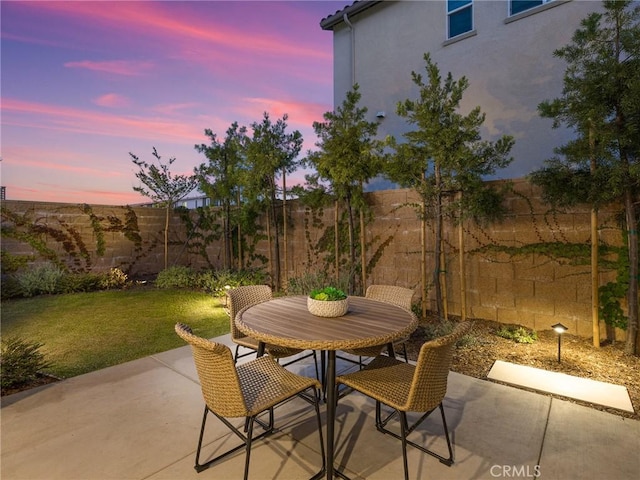 27636 S Evergreen Pl, San Pedro, CA 90732 - patio terrace at dusk featuring a patio, a fenced backyard, and outdoor dining area