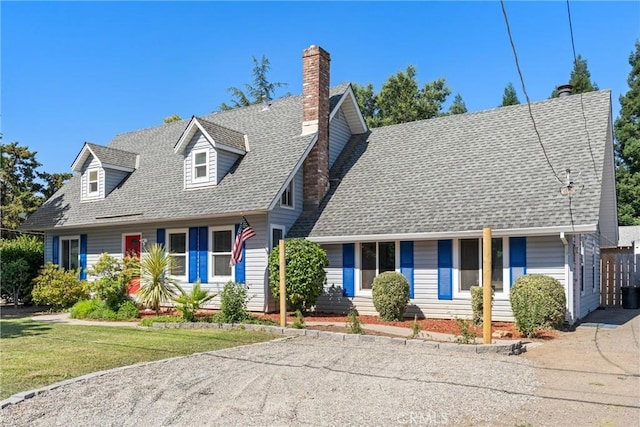9287 Holland Ave, Durham, CA 95938 - cape cod house featuring roof with shingles, a chimney, and a front yard
