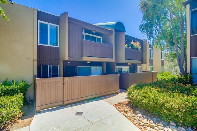 3454 Castle Glen Dr Unit 115, San Diego, CA 92123 - view of front of property featuring a gate and stucco siding