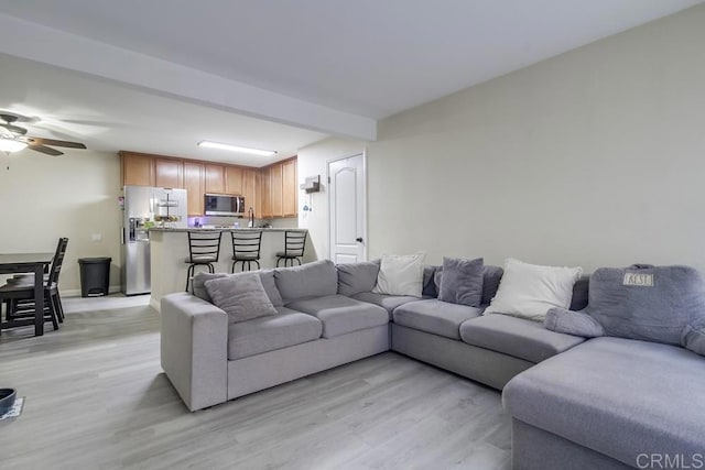 3454 Castle Glen Dr Unit 115, San Diego, CA 92123 - living room with light wood finished floors and ceiling fan