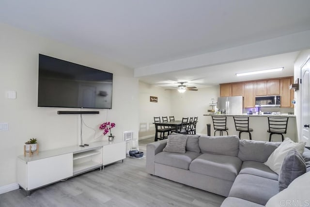 3454 Castle Glen Dr Unit 115, San Diego, CA 92123 - living area with light wood-style floors and a ceiling fan
