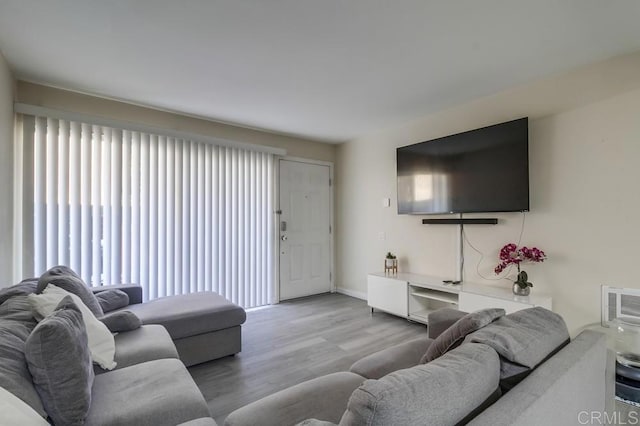 3454 Castle Glen Dr Unit 115, San Diego, CA 92123 - living area featuring plenty of natural light and wood finished floors