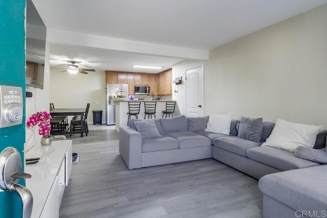 3454 Castle Glen Dr Unit 115, San Diego, CA 92123 - living area featuring light wood-style floors and ceiling fan
