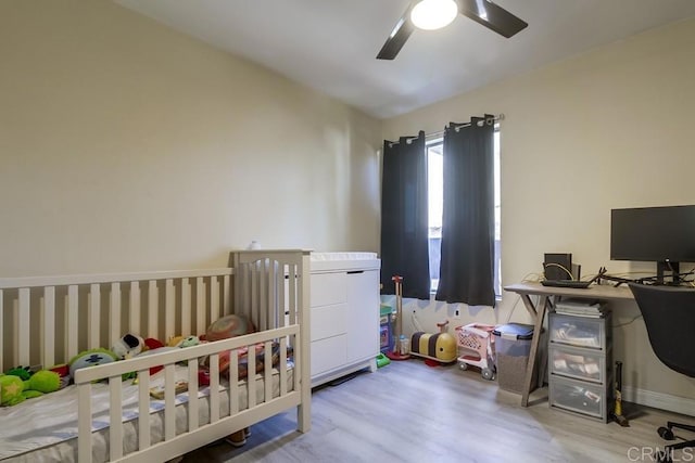 3454 Castle Glen Dr Unit 115, San Diego, CA 92123 - bedroom featuring wood finished floors, a desk, and a ceiling fan