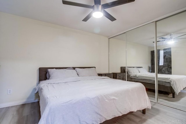 3454 Castle Glen Dr Unit 115, San Diego, CA 92123 - bedroom featuring wood finished floors, a closet, and ceiling fan